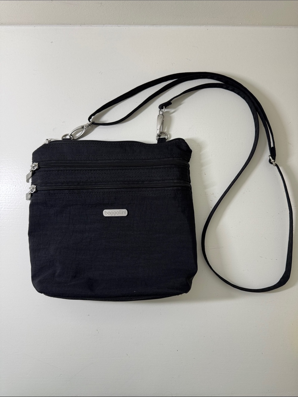 Baggalini black nylon crossbody bag with matching integrated mini bag/wallet. - Picture 3 of 16